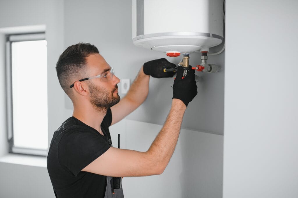 Technician performing water heater maintenance in Orlando